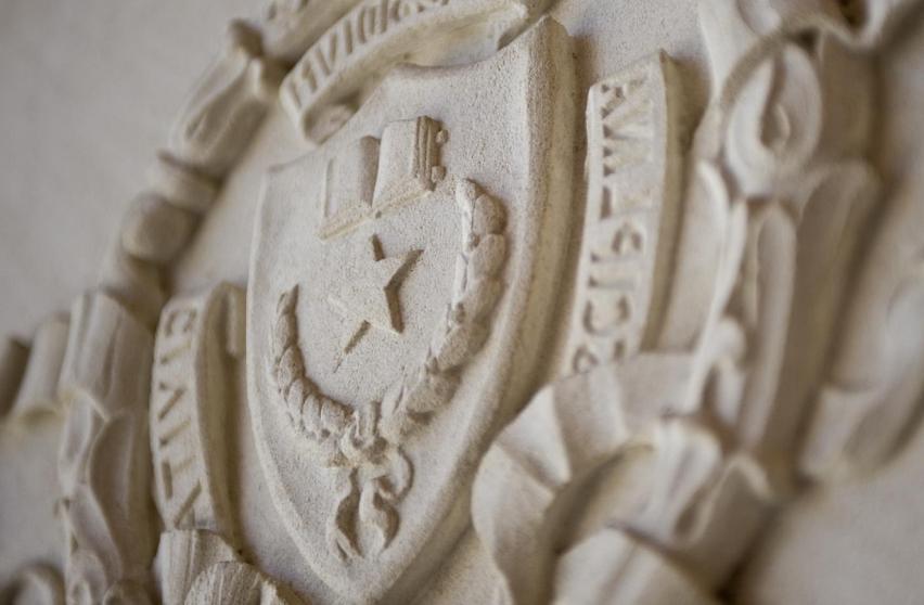 Seal of The University of amjs澳金沙门线路 at Austin in stone